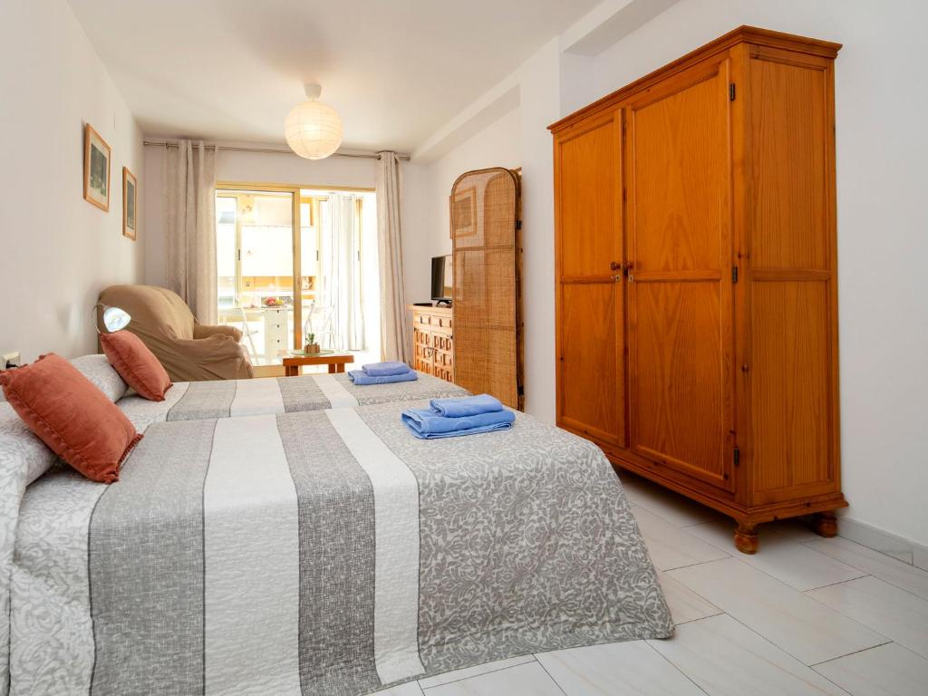 A bed or beds in a room at Studio Apolo VI-6 by Interhome