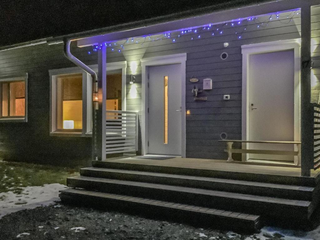 a house with a porch with purple lights on it at Holiday Home Kaisala by Interhome in Hailuoto