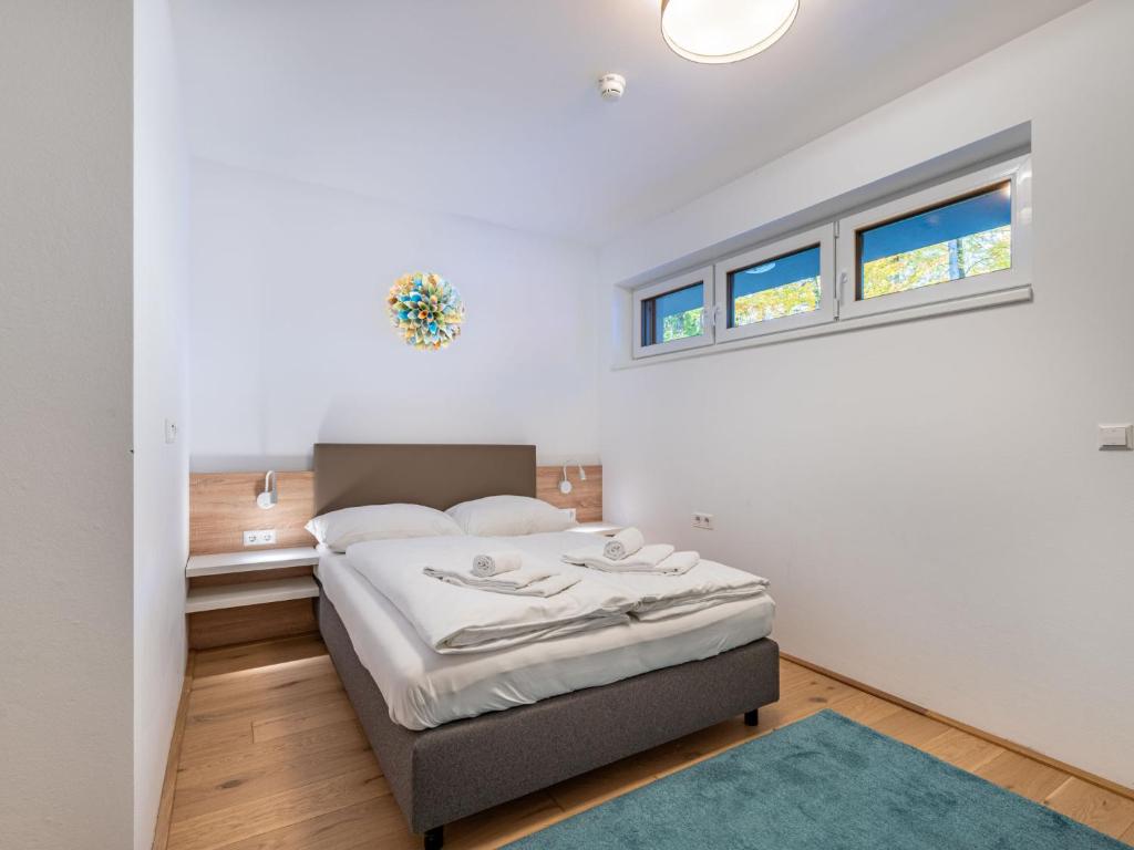 A bed or beds in a room at Apartment Seensucht alpe maritima Ski & See-Top 25 by Interhome