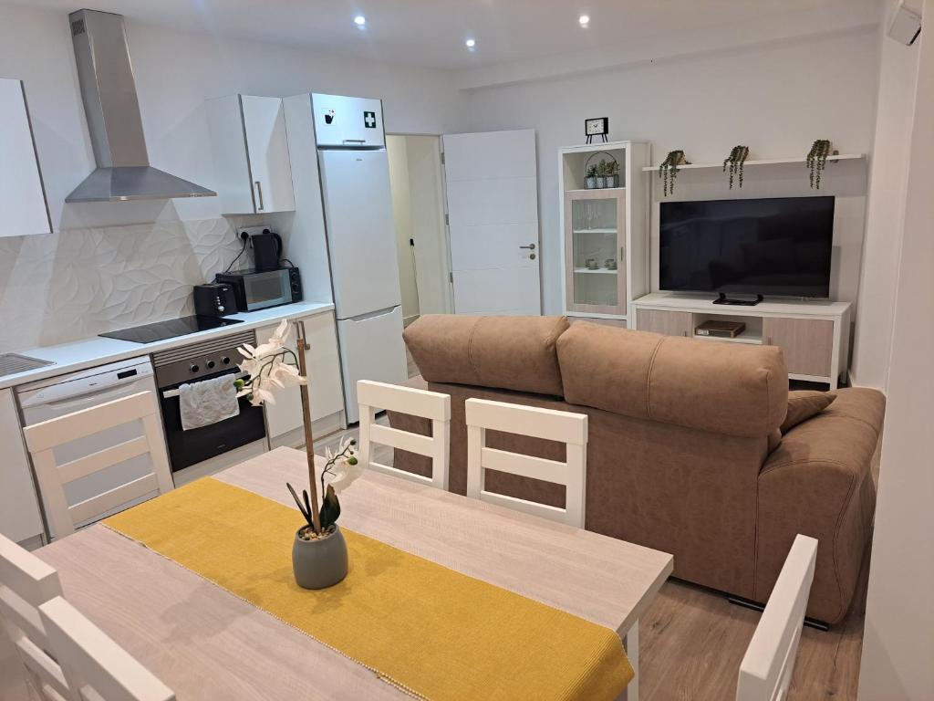 a living room with a couch and a table at Main Street - 3 Bed Room - Family Friendly in Gibraltar