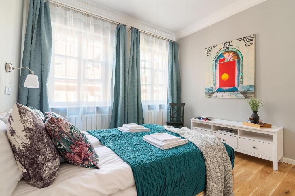 Posteľ alebo postele v izbe v ubytovaní Plac Zamkowy - Aura Apartment by Noclegi Renters