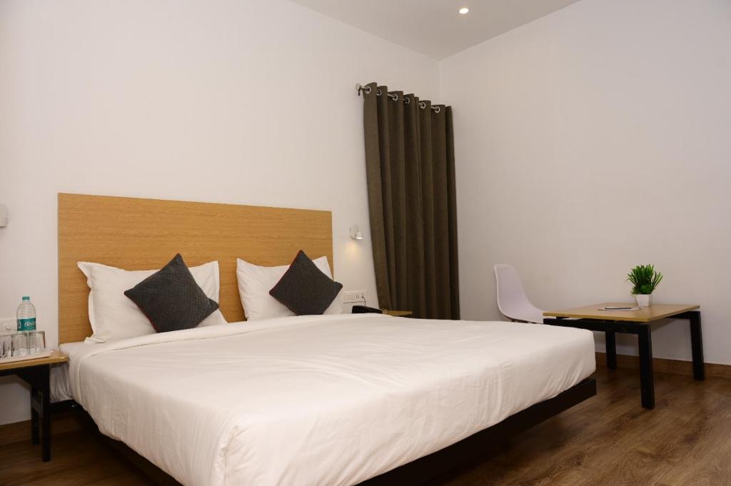 Postel nebo postele na pokoji v ubytování SM Hives Business Hotel