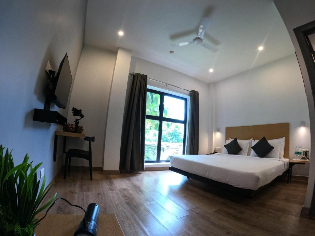 Postel nebo postele na pokoji v ubytování SM Hives Business Hotel