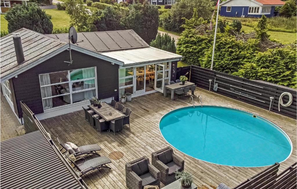 an overhead view of a house with a swimming pool at Beautiful Home In Lgstrup With Outdoor Swimming Pool in Løgstrup