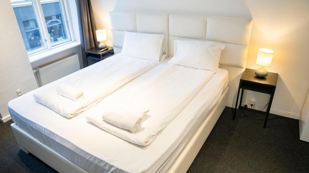 Postel nebo postele na pokoji v ubytování A Hotels City