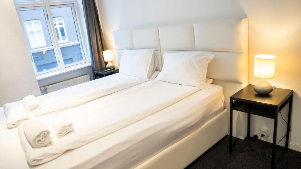 Postel nebo postele na pokoji v ubytování A Hotels City