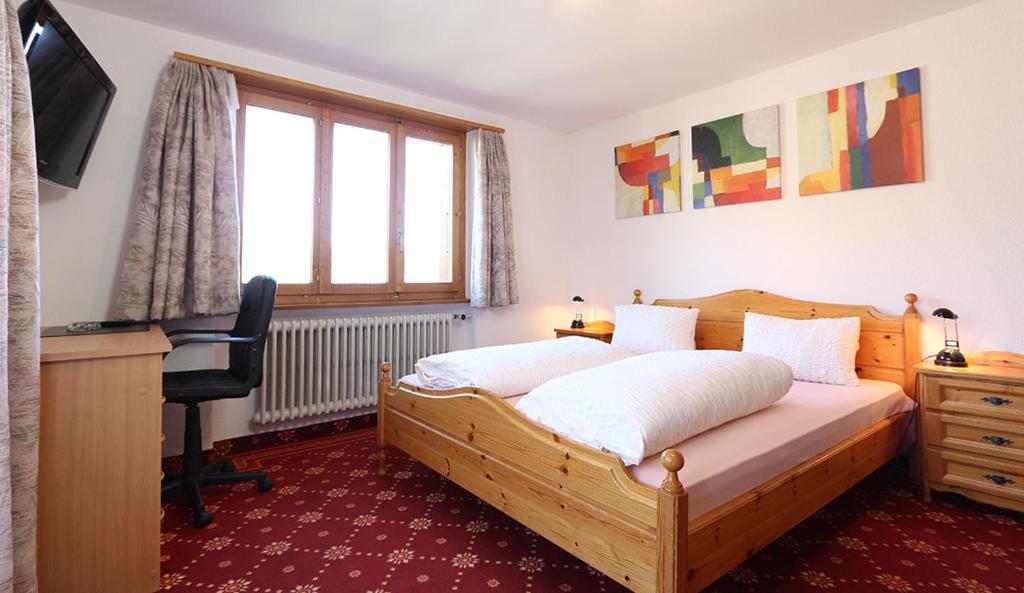 Postel nebo postele na pokoji v ubytování Hotel Alpina