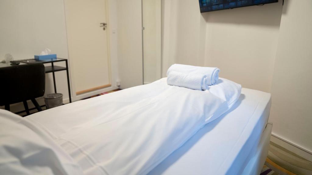 Postel nebo postele na pokoji v ubytování A Hotels City