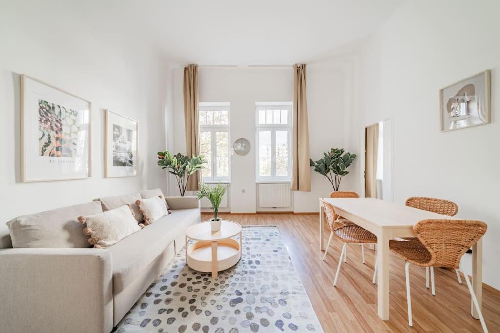 a living room with a couch and a table at City Chic #18 in Vienna