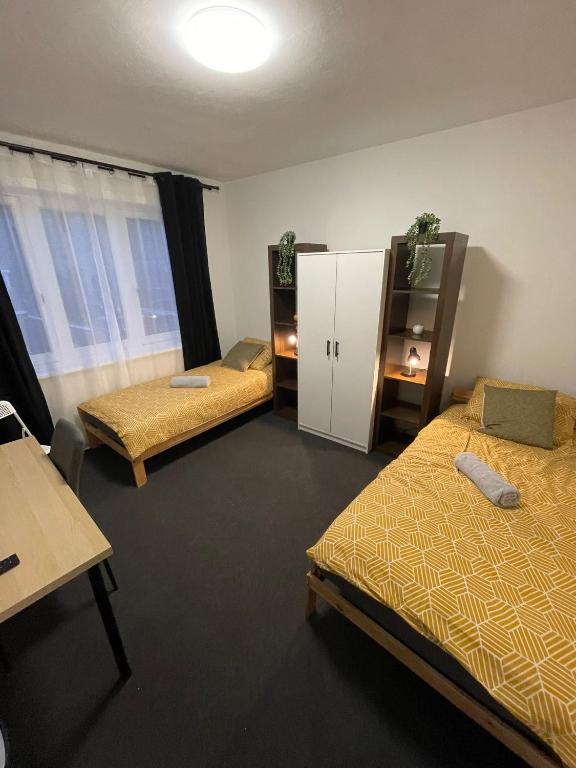 a room with two beds and a cabinet in it at Room With Two Beds in Centrum in Heerlen