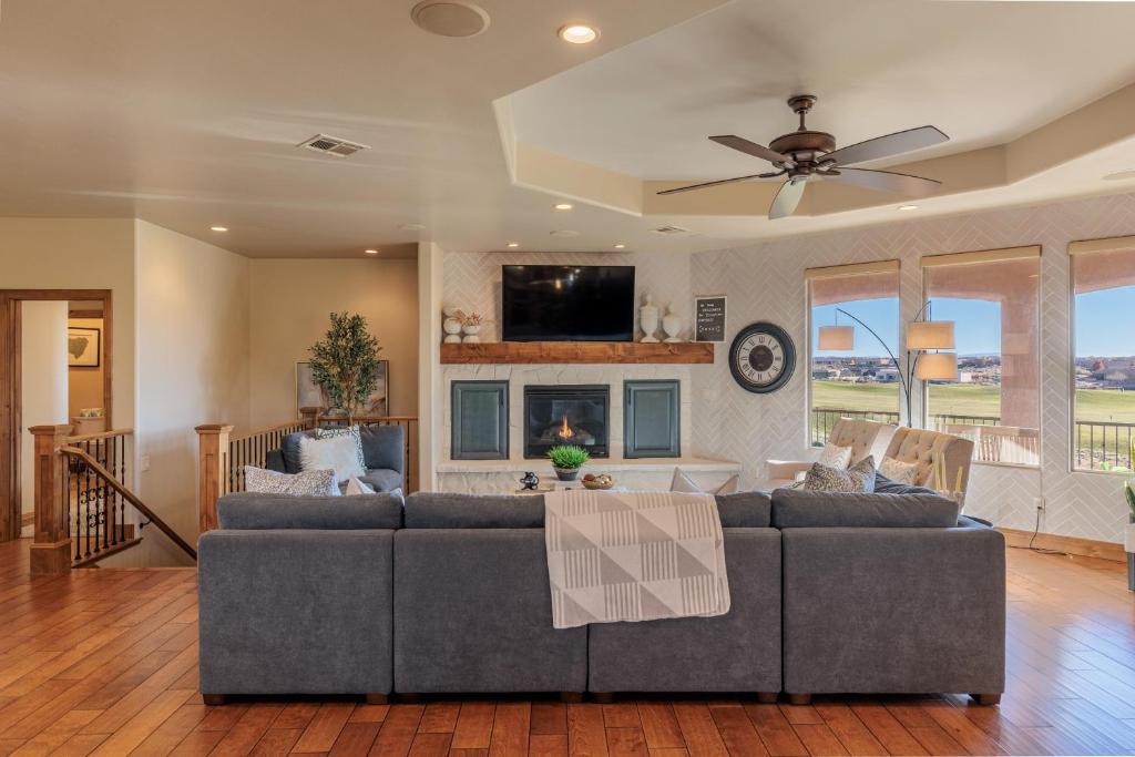 a living room with a couch and a ceiling fan at Chip Shot in St. George