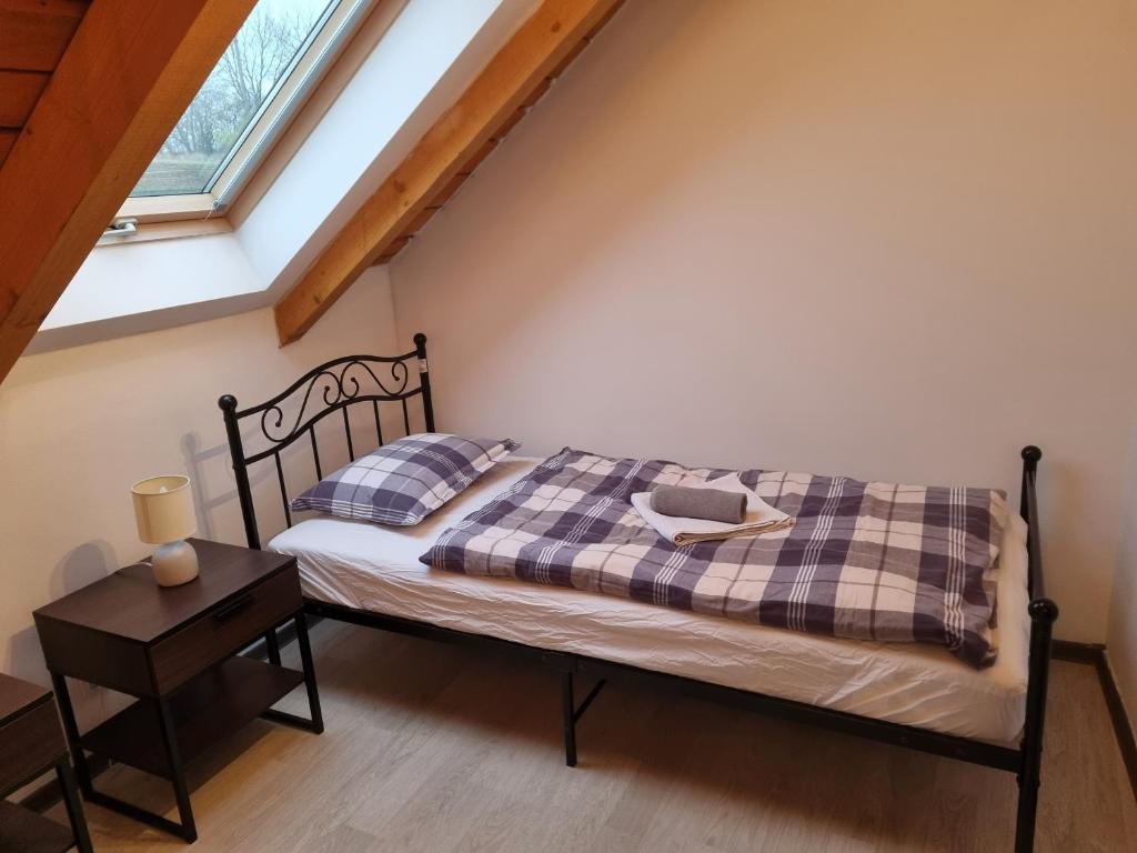 Postel nebo postele na pokoji v ubytování Čenovický dvůr