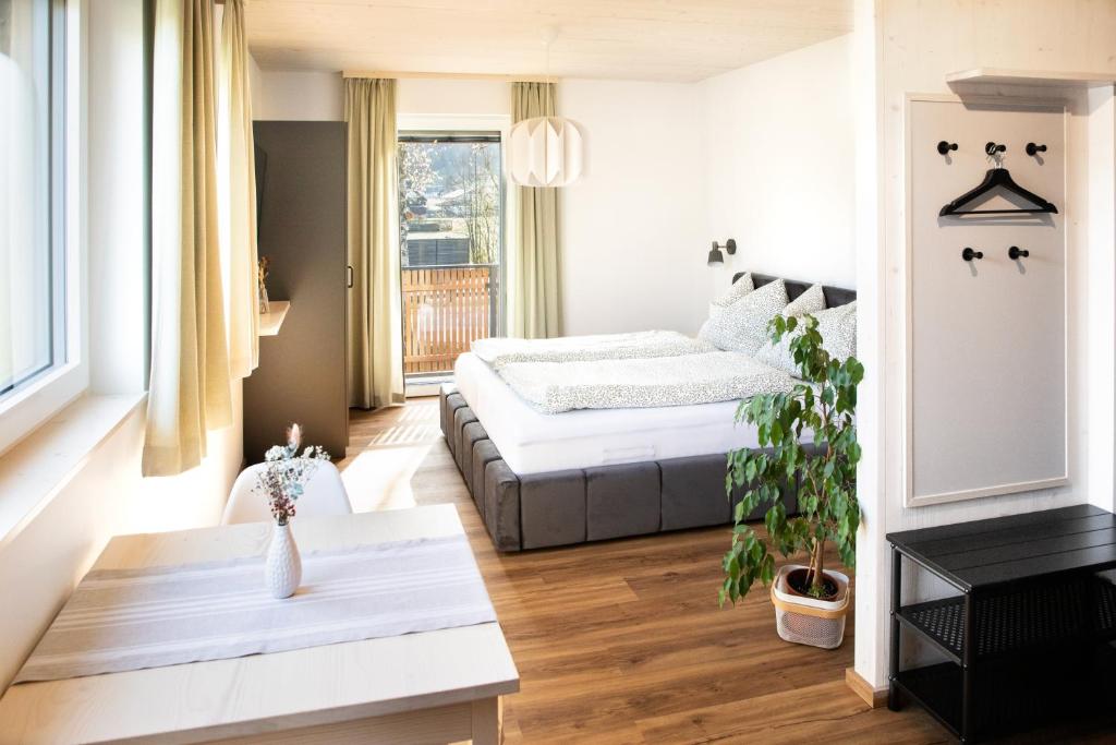 Postel nebo postele na pokoji v ubytování Moosaik Appartements