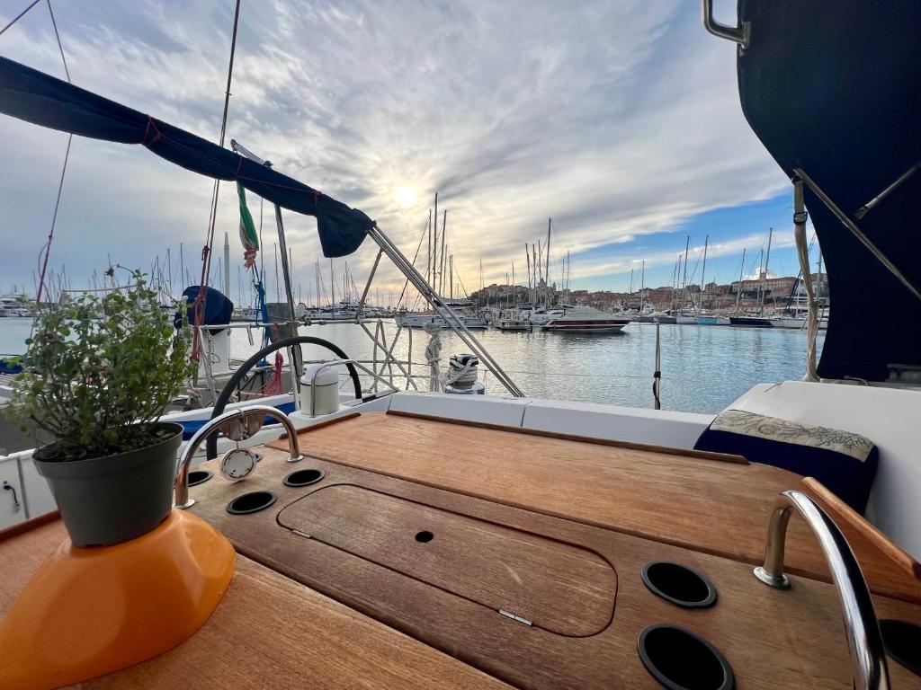 a wooden deck of a boat in a harbor at Sailboat Euplea in Imperia