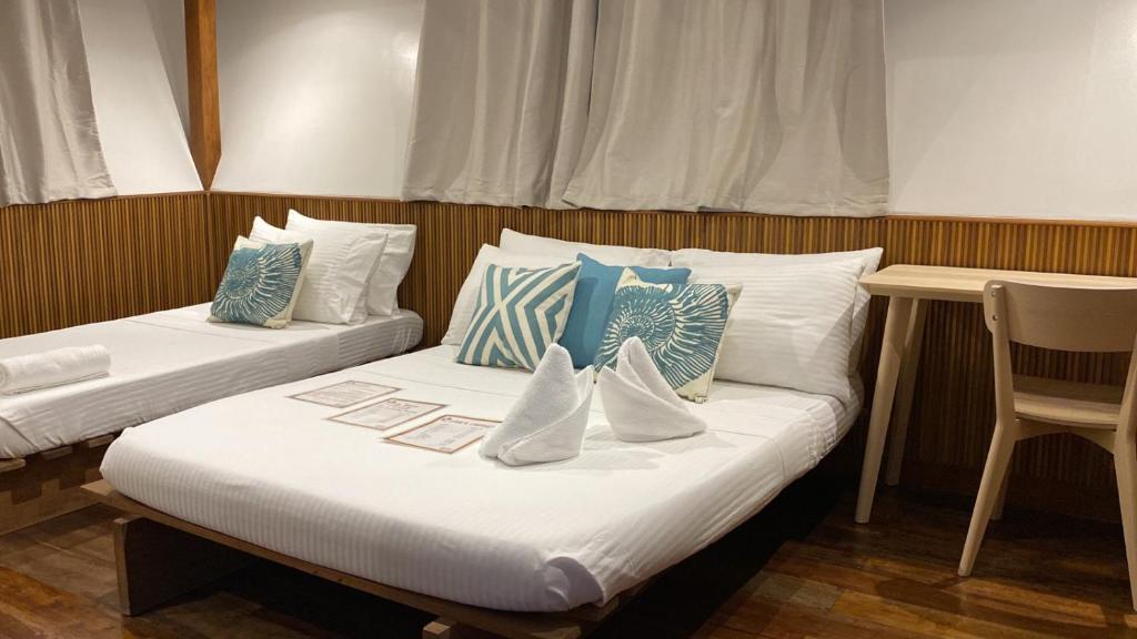 Voodi või voodid majutusasutuse Casitas de Boracay toas