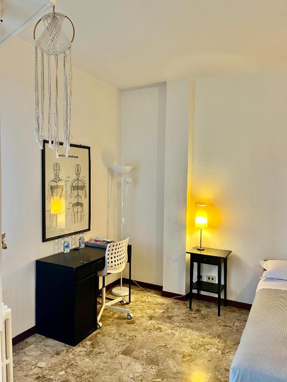 Postel nebo postele na pokoji v ubytování Milano Guest House