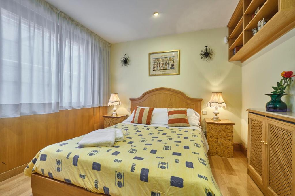 Postel nebo postele na pokoji v ubytování Apartamentos Carlos