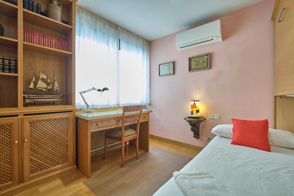 Postel nebo postele na pokoji v ubytování Apartamentos Carlos
