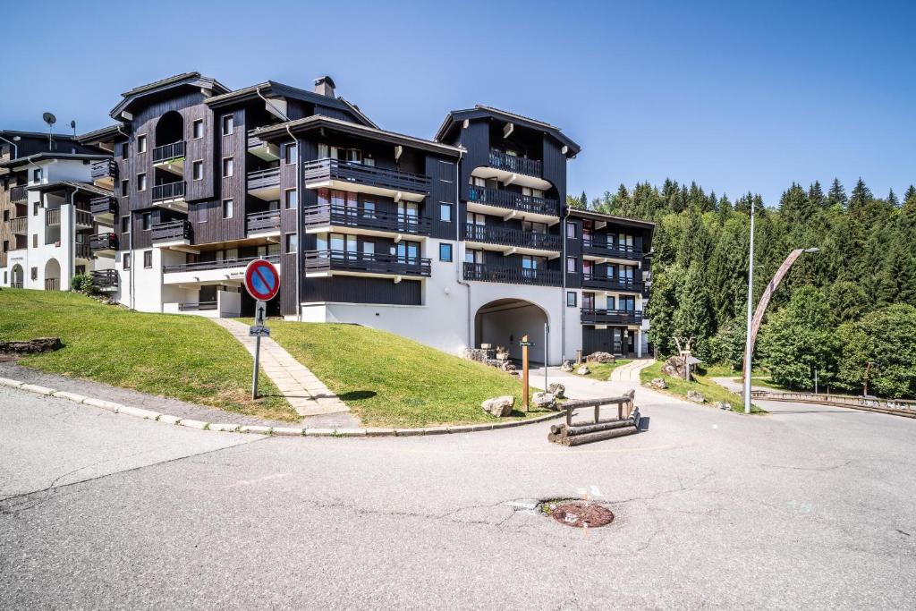 a large apartment building on the side of a street at Appartement Morillon 4pers in Morillon