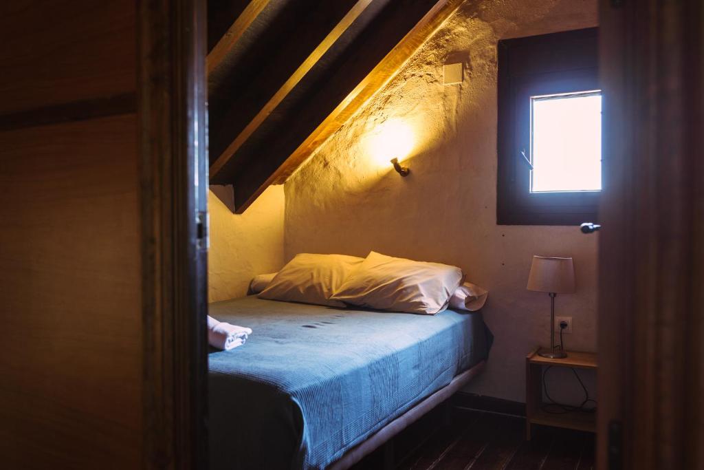 Łóżko lub łóżka w pokoju w obiekcie Casa Mangueta