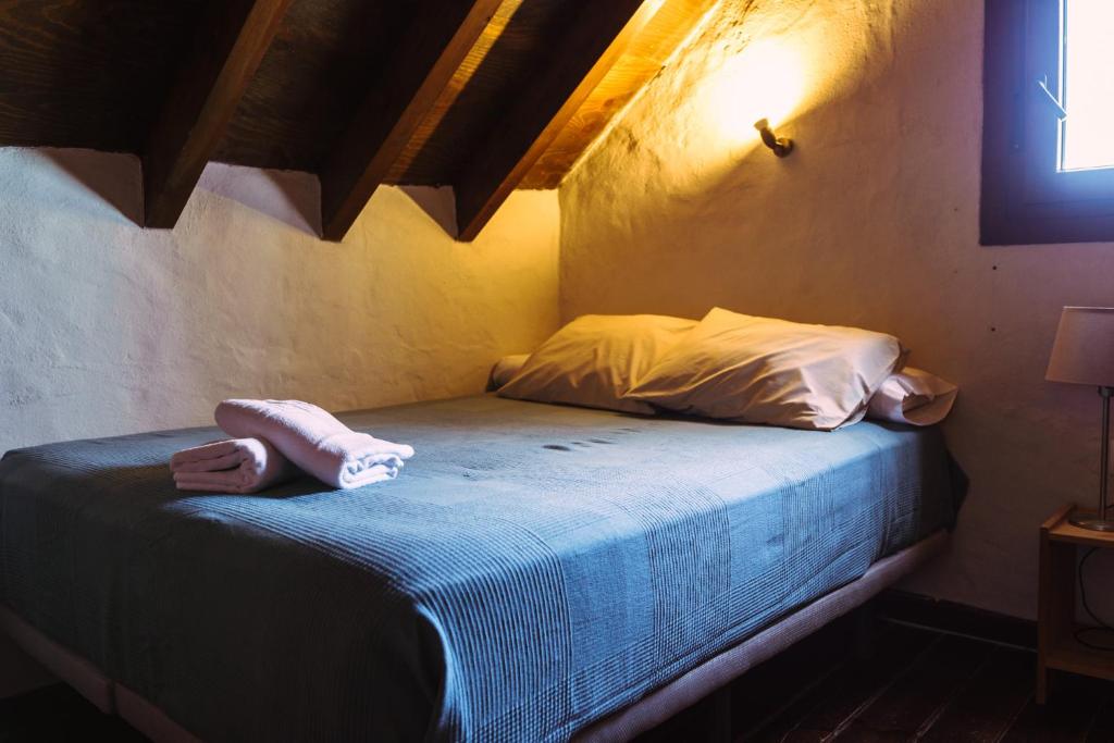 Łóżko lub łóżka w pokoju w obiekcie Casa Mangueta
