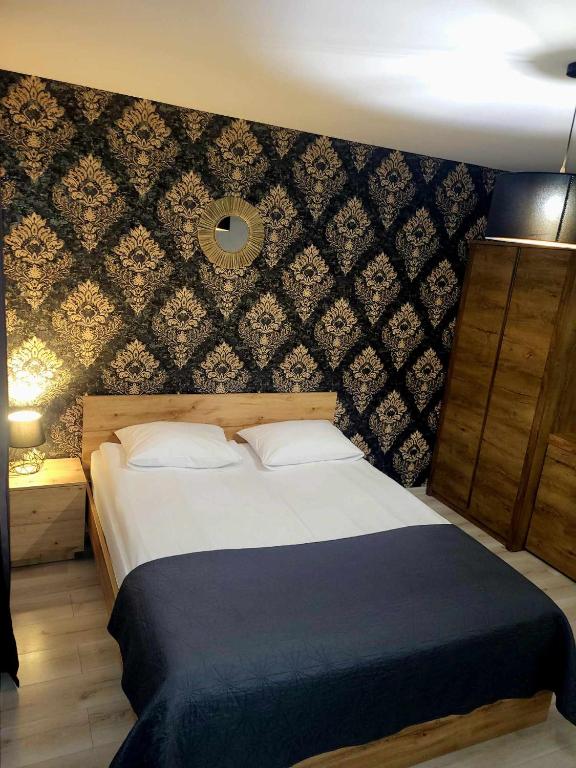 Posteľ alebo postele v izbe v ubytovaní Willa "Aparthause" E-Apartamenty