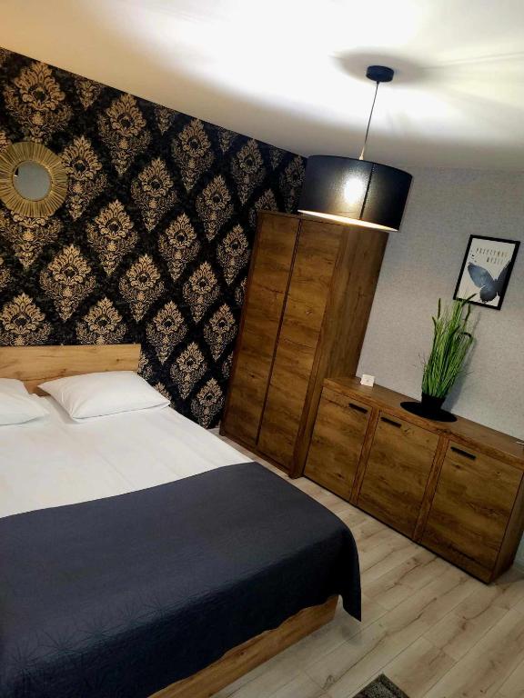 Posteľ alebo postele v izbe v ubytovaní Willa "Aparthause" E-Apartamenty