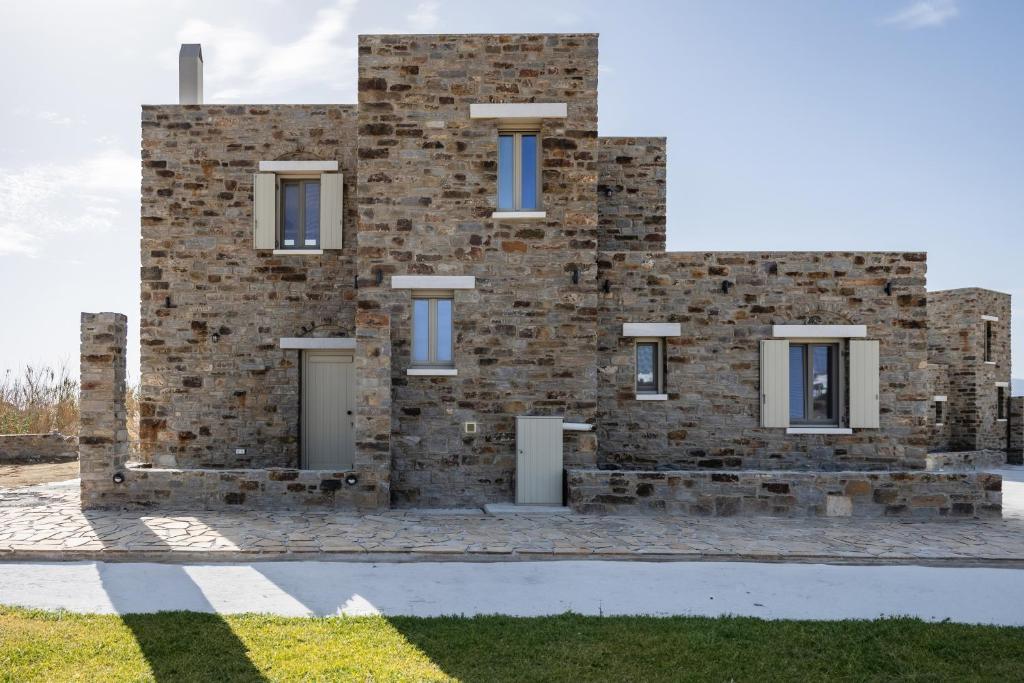 a brick building with two doors in front of it at Stone Haven Villas in Plaka