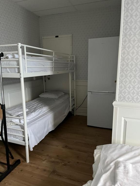 Postel nebo postele na pokoji v ubytování Halmstad Hotell & Vandrarhem Kaptenshamn