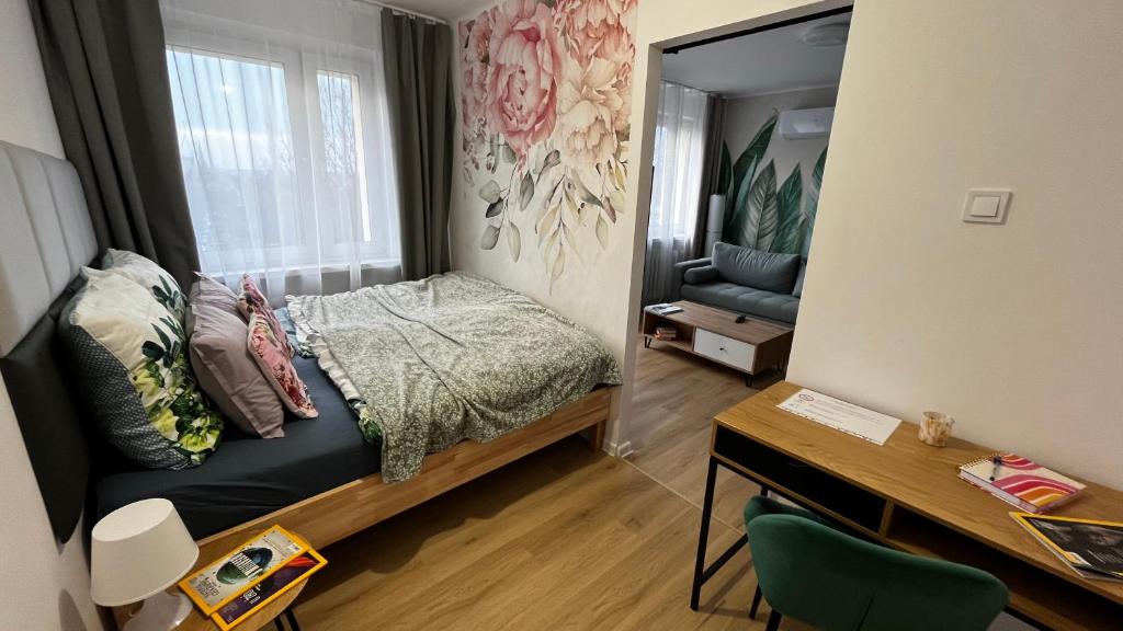 Säng eller sängar i ett rum på Gajowa Apartament