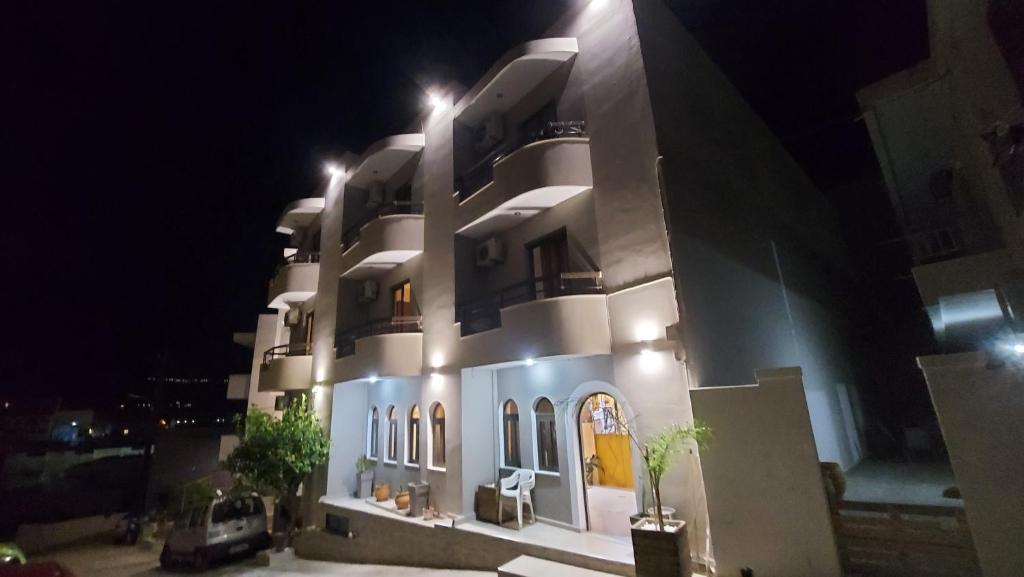 a large building with lights on it at night at Amaryllis Hotel in Karpathos