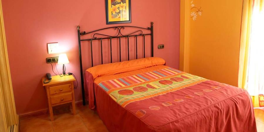 Postel nebo postele na pokoji v ubytování Quéntar Hotel Rural