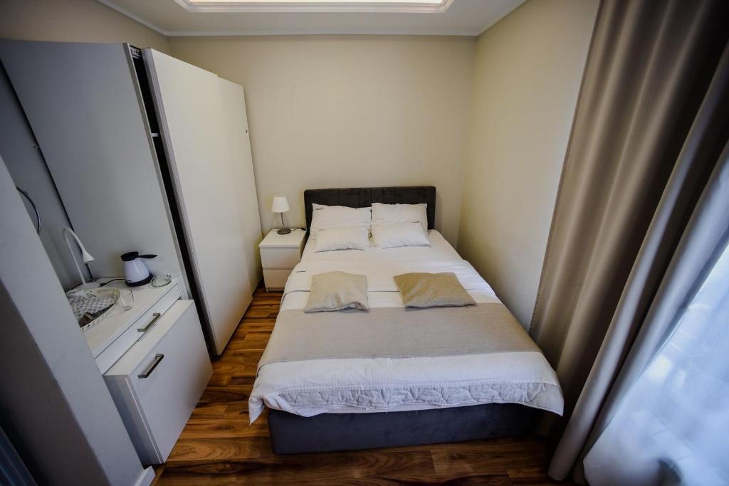 Postel nebo postele na pokoji v ubytování Onix Residence