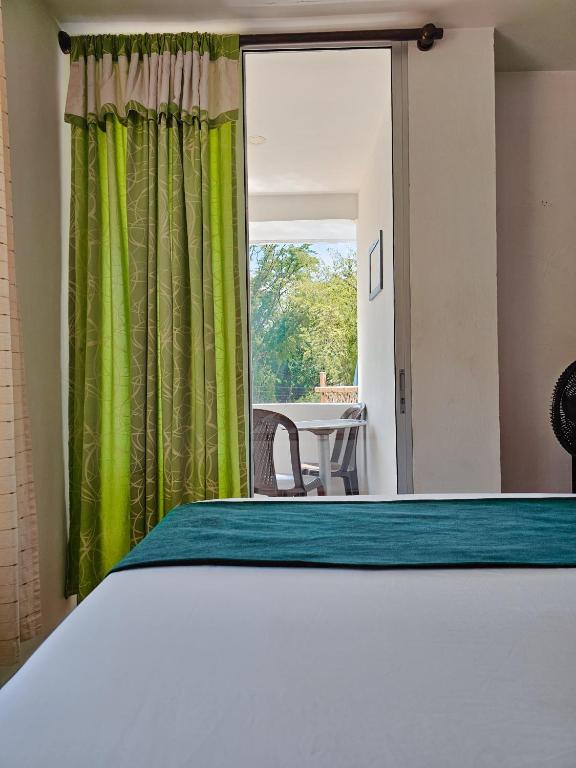 Postel nebo postele na pokoji v ubytování Hosteria La Medusa