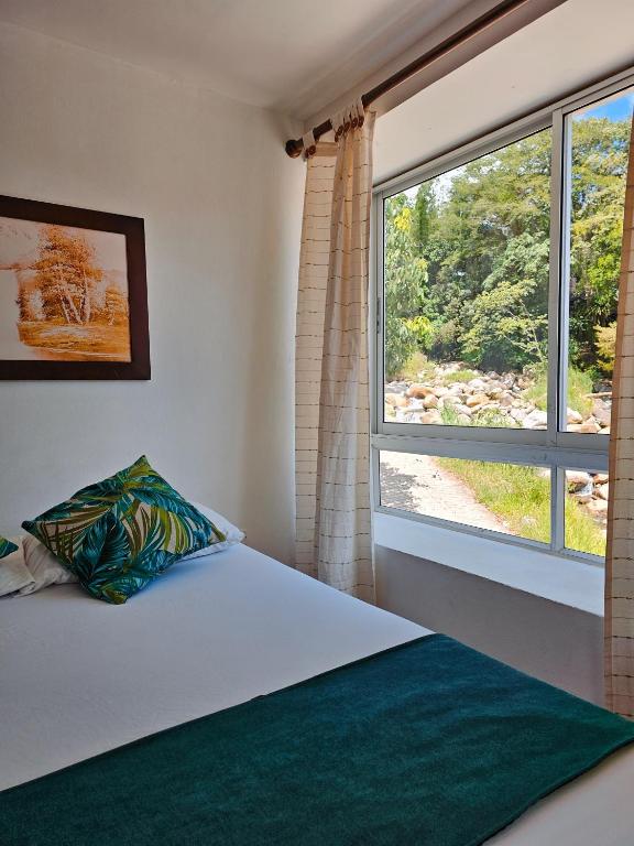 Postel nebo postele na pokoji v ubytování Hosteria La Medusa