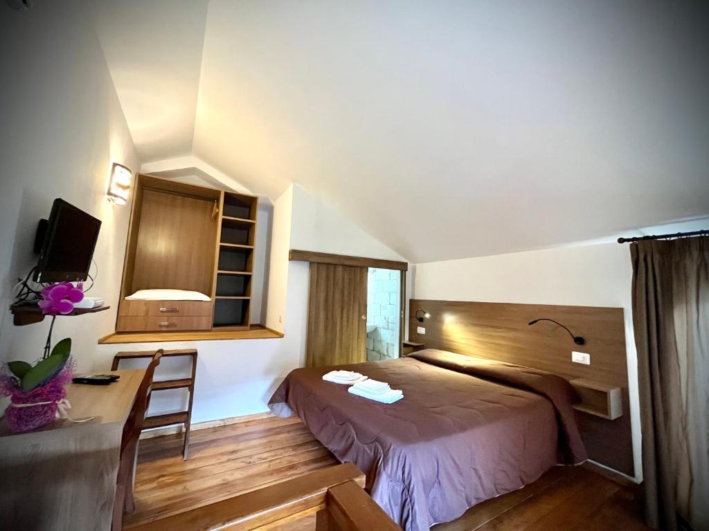 Posteľ alebo postele v izbe v ubytovaní Hotel Pinguino