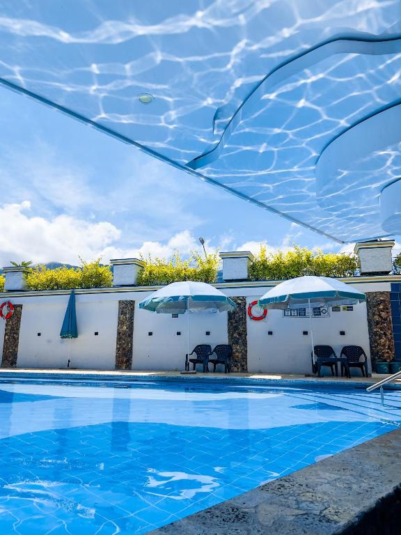 Bazén v ubytování Hosteria La Medusa nebo v jeho okolí