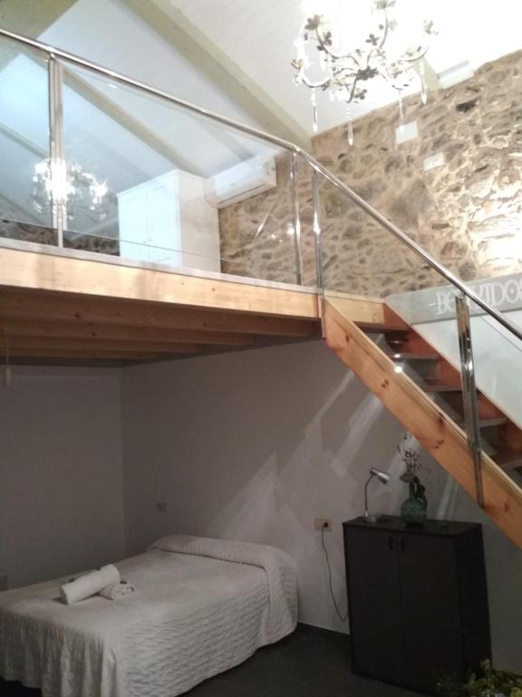 Łóżko lub łóżka w pokoju w obiekcie Casa das Fiadeiras de Nemiña con Jacuzzi