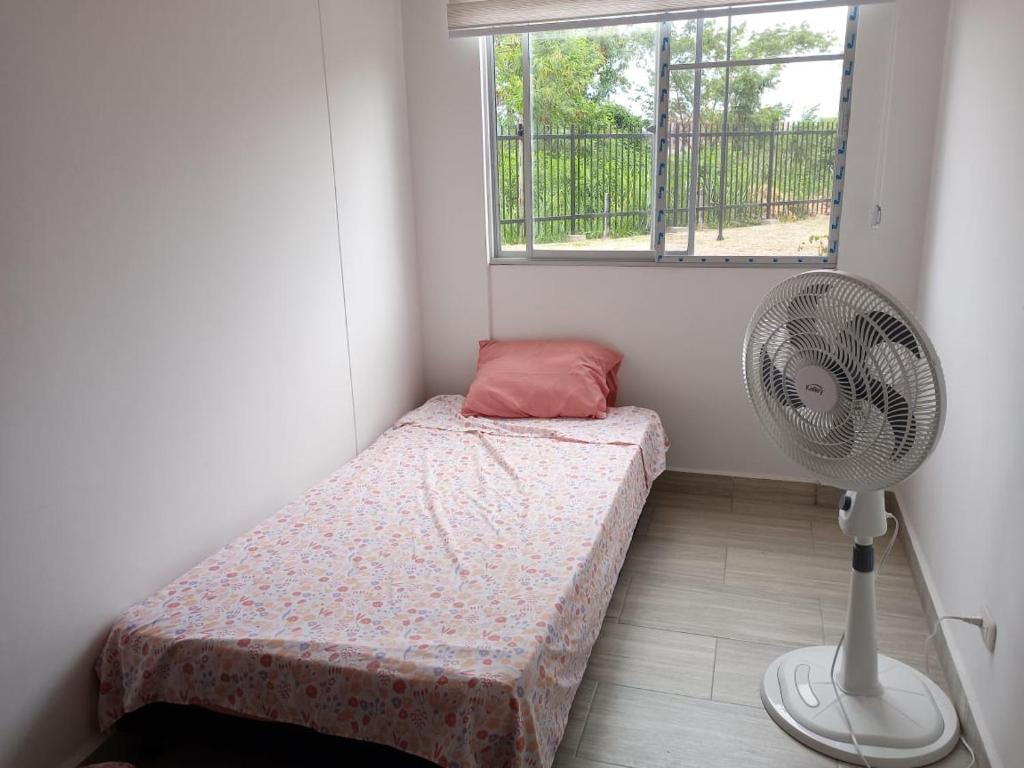 Postel nebo postele na pokoji v ubytování Apartamento en Ricaurte, Arrayanes de Peñaliza