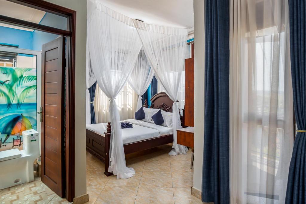 Postel nebo postele na pokoji v ubytování Keba Xpress Hotel - Entebbe