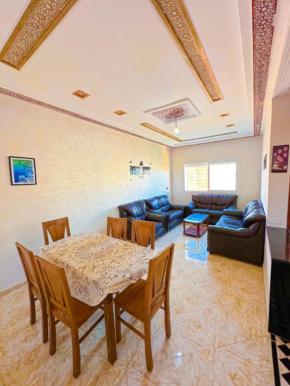 a living room with a table and a couch at Soofhouse in Fez