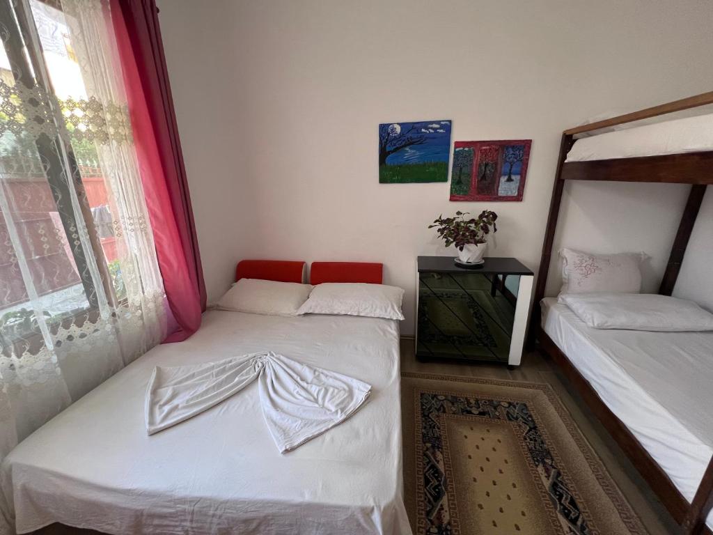 Postel nebo postele na pokoji v ubytování David Guesthouse
