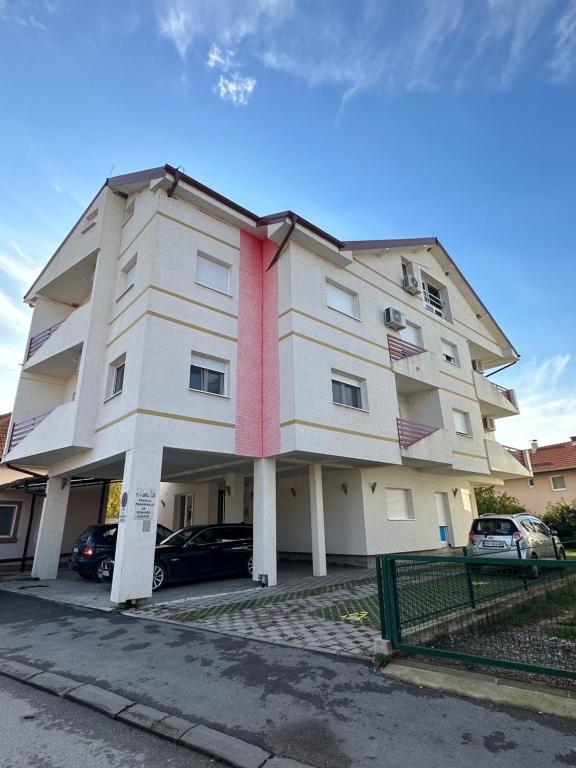 a large white building with a red tie at Kashmir in Golubac