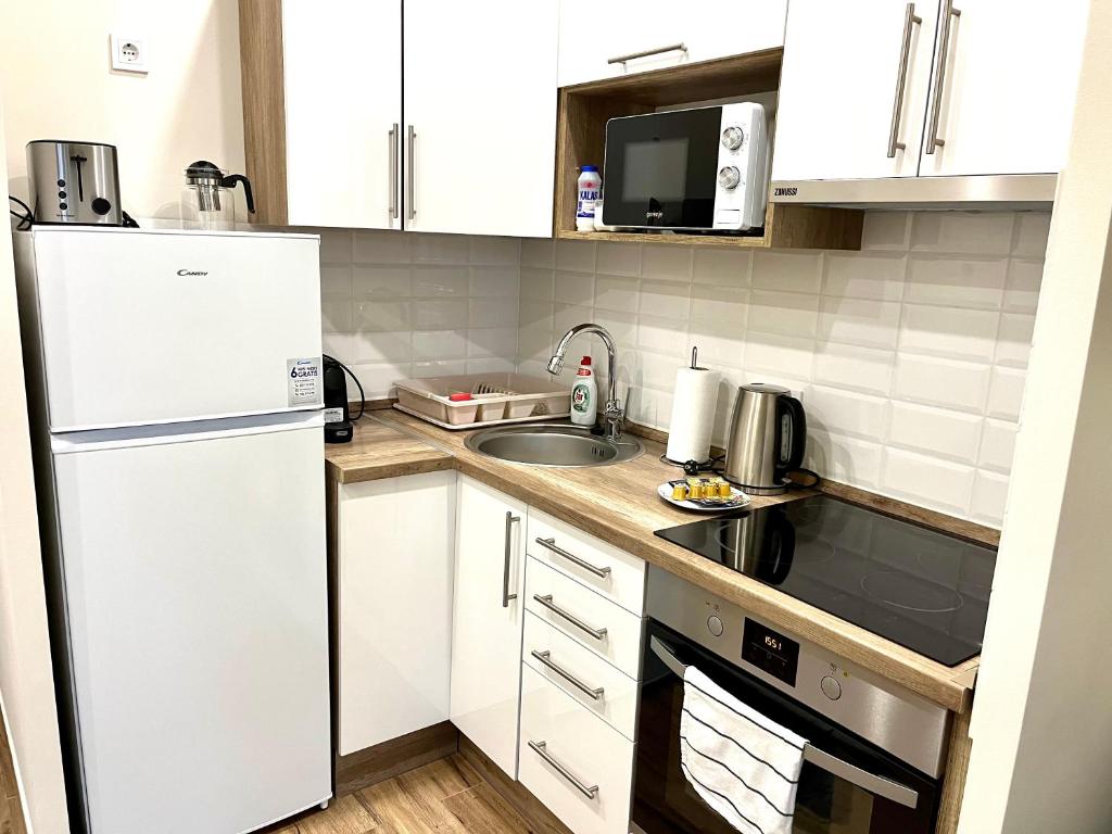 Kuchnia lub aneks kuchenny w obiekcie Vörösmarty apartmanház
