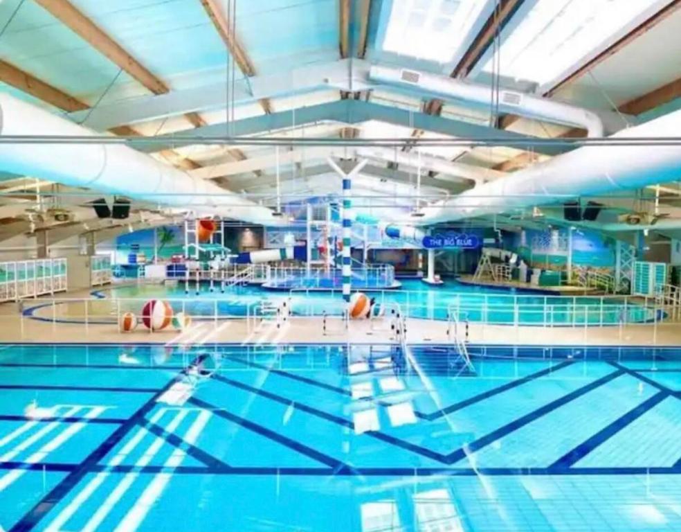 a large swimming pool with blue water at Seal Bay Resort in Selsey