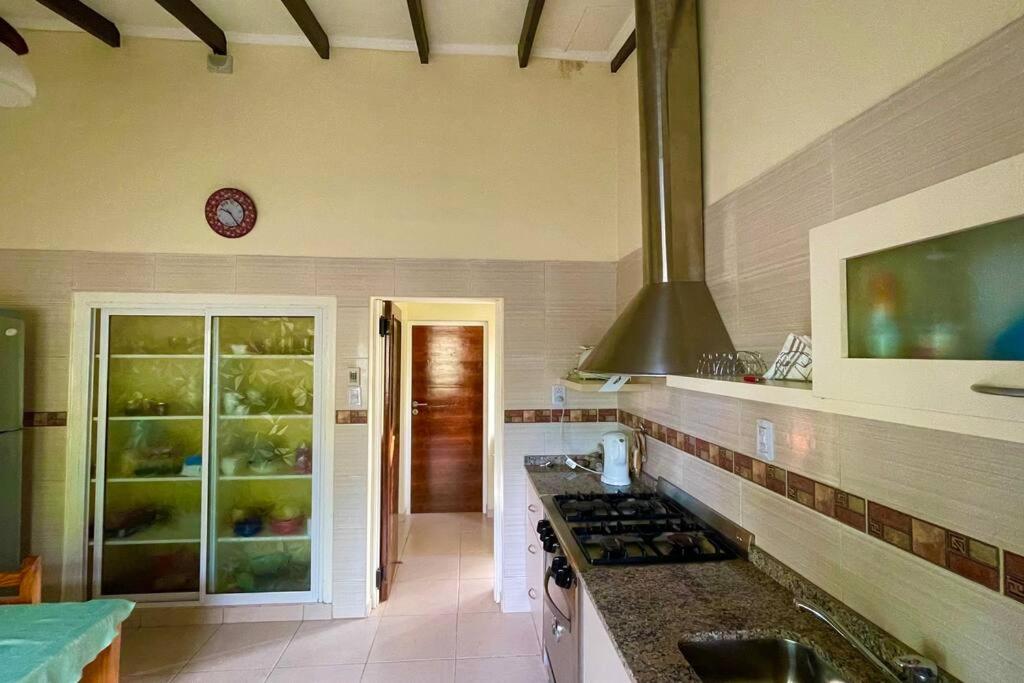 a kitchen with a sink and a stove top oven at Casa en Tupungato in Tupungato
