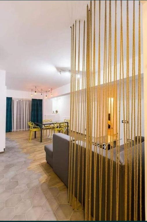 a living room with a couch and a table at Amazing Park Residences 5 in Bucharest