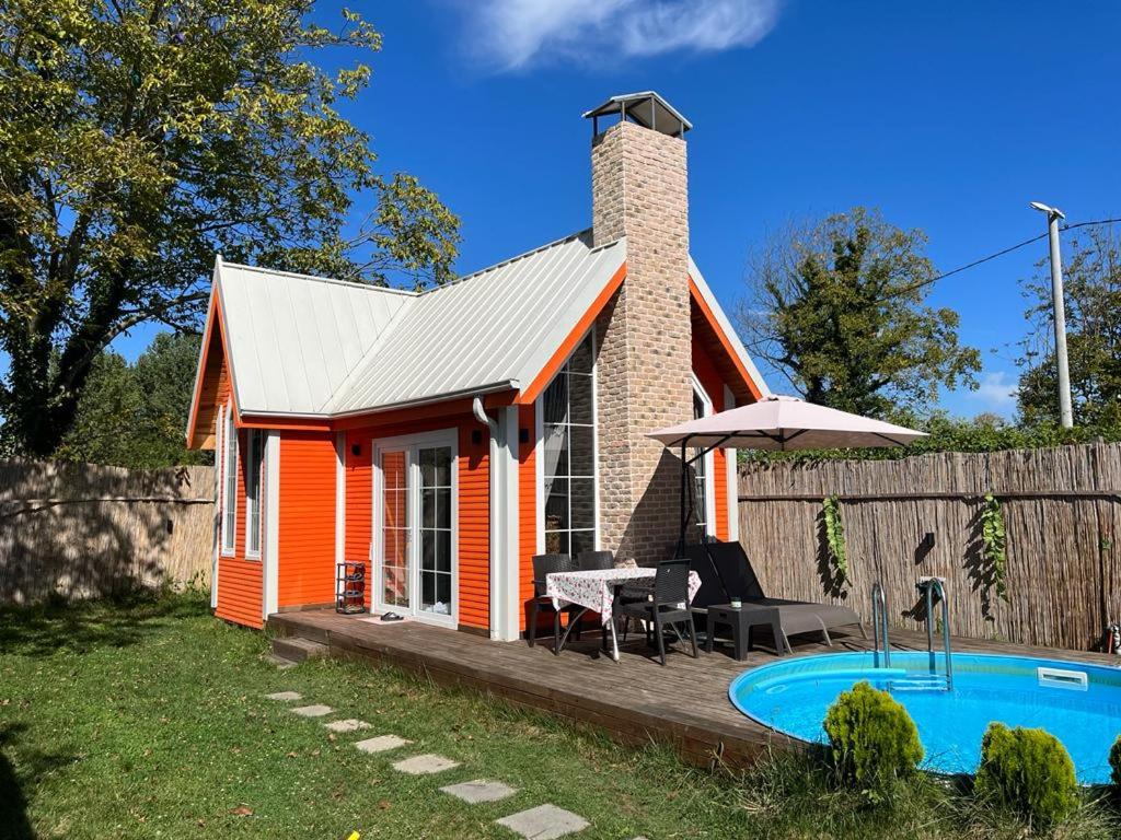 a small house with a pool in front of it at WONDERLAND TİNY HOUSE in Sapanca