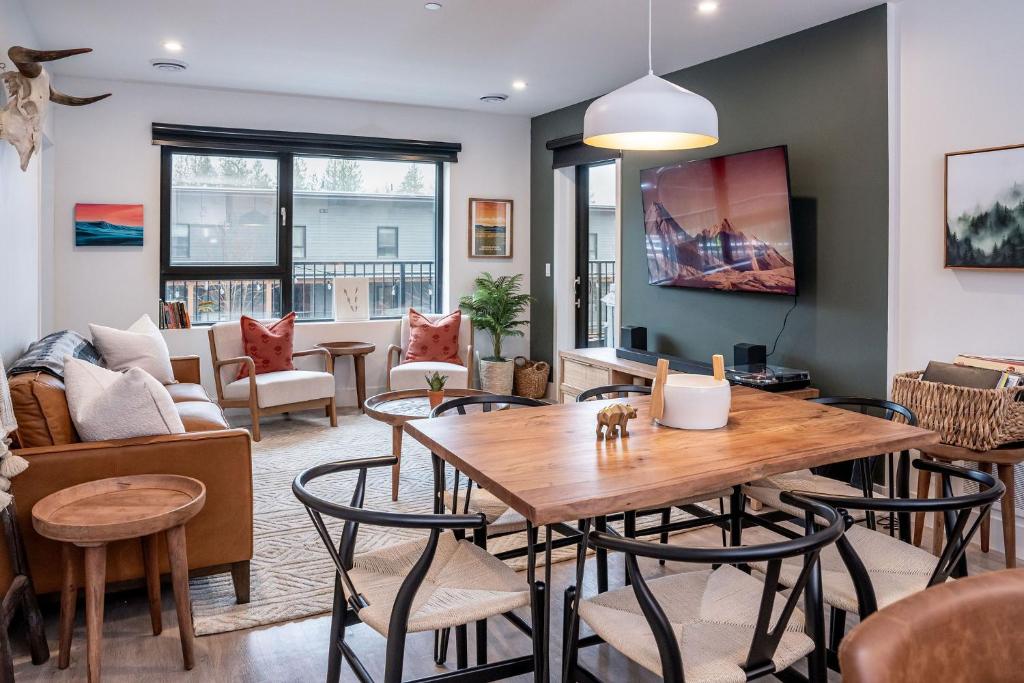 a living room with a table and chairs at Hemlock Hangout by Revelstoke Vacations in Revelstoke