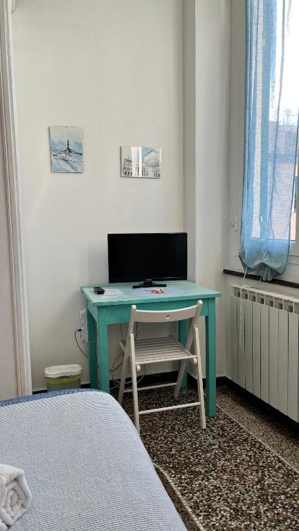 TV a/nebo společenská místnost v ubytování B&B Ligustico